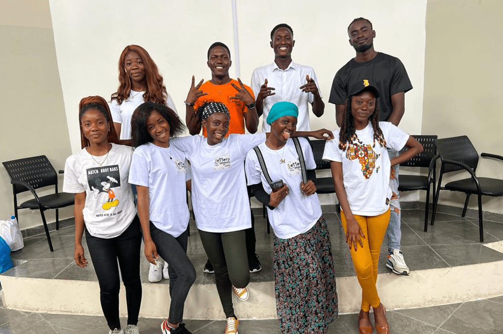 a group of young people posing for a photo.